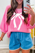 Pink Sweater with White Bow Detail